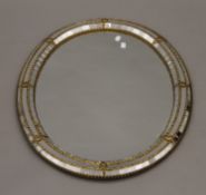 A gilt-framed mirror. 76 cm wide.