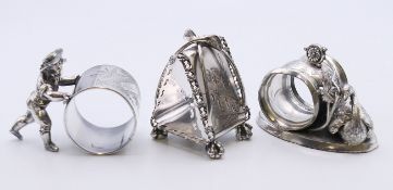 Two Meriden & Co silver plate napkin rings and a Rogers & Bro napkin ring.