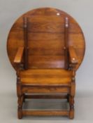 An oak monk's chair. 90 cm wide.