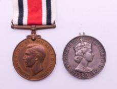 A General Service medal awarded to 23310170 GNR J FERGUSON RA and a George VI Faithful Service in