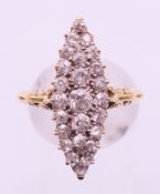 An unmarked gold diamond navette ring. Ring size Q.