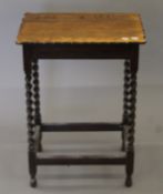 An early 20th century oak barley twist side table. 52 cm wide.