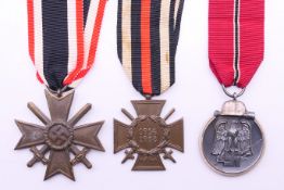 Three German medals with ribbons, to include a 1914-1918 WWI medal,