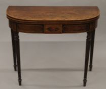 A 19th century mahogany demi-lune tea table. 91 cm wide.