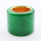 A jade archer's ring with a gilt interior. 3 cm high.