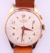 An 18 K gold cased Sultana gentleman's wristwatch. 3.5 cm diameter. 33.7 grammes total weight.