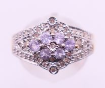 A 9 ct gold, diamond and tanzanite ring. Ring size Q.