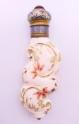 An antique porcelain scent bottle with hand-painted decoration and a cloisonne top. 10.5 cm high.