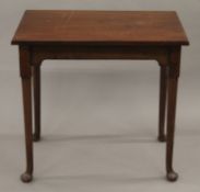 An 18th century-style mahogany side table. 74 cm wide.