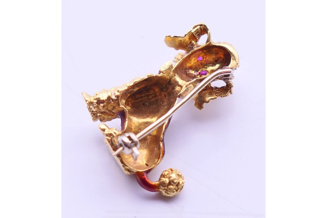 An 18 ct gold poodle dog brooch with ruby set eyes and enamel decoration.. 2.75 cm high. 8. - Image 2 of 3