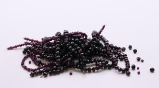 A bag of garnet necklaces.
