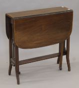 An Edwardian mahogany Sutherland table. 68 cm wide.