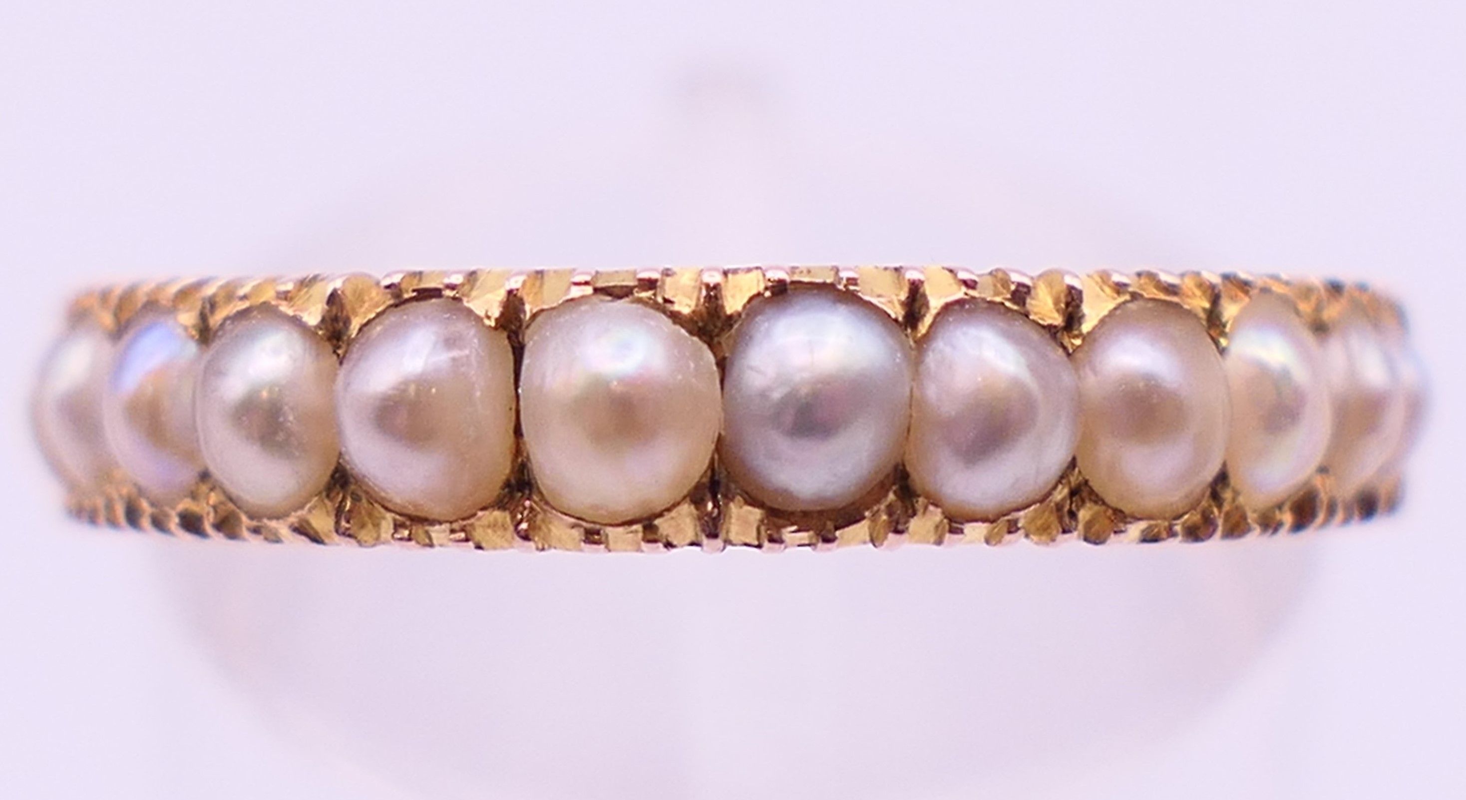 An unmarked gold, diamond and seed pearl ring, and another unmarked gold and seed pearl ring. - Image 2 of 11