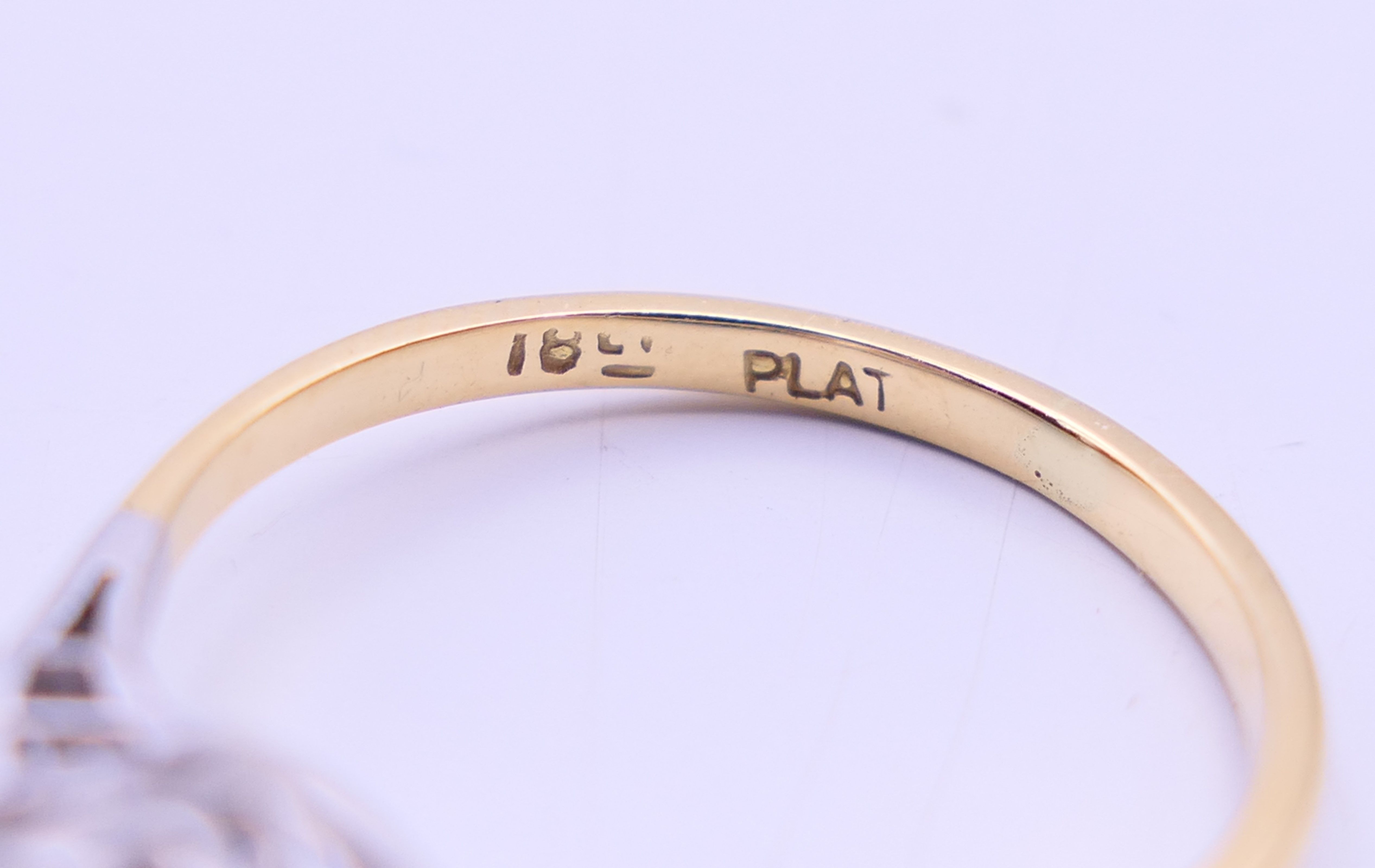 An 18 ct gold and platinum five stone diamond ring. The central stone spreading to approximately 1. - Image 4 of 5