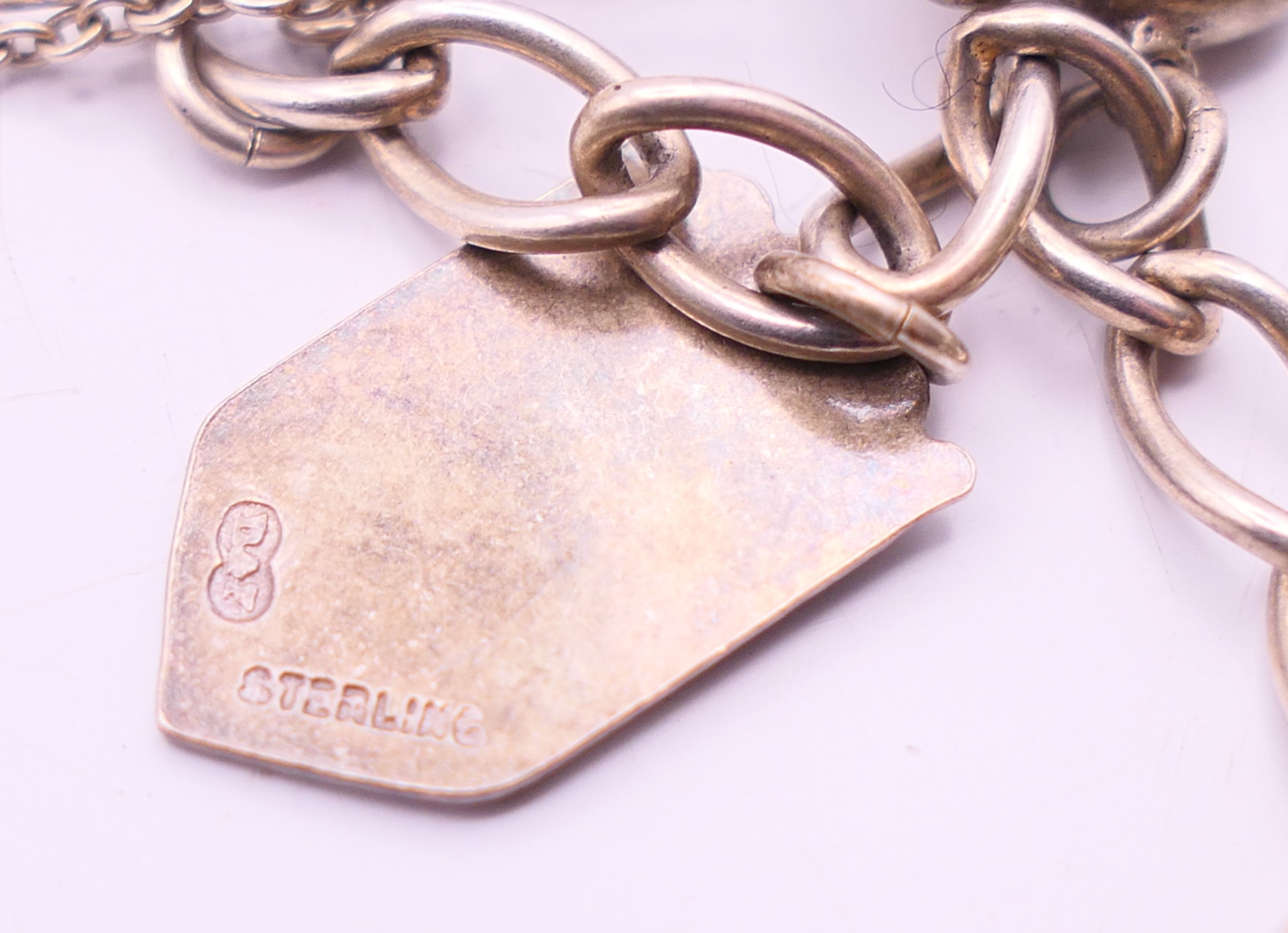A silver charm bracelet and a silver necklace. The later 34 cm long. - Image 9 of 9