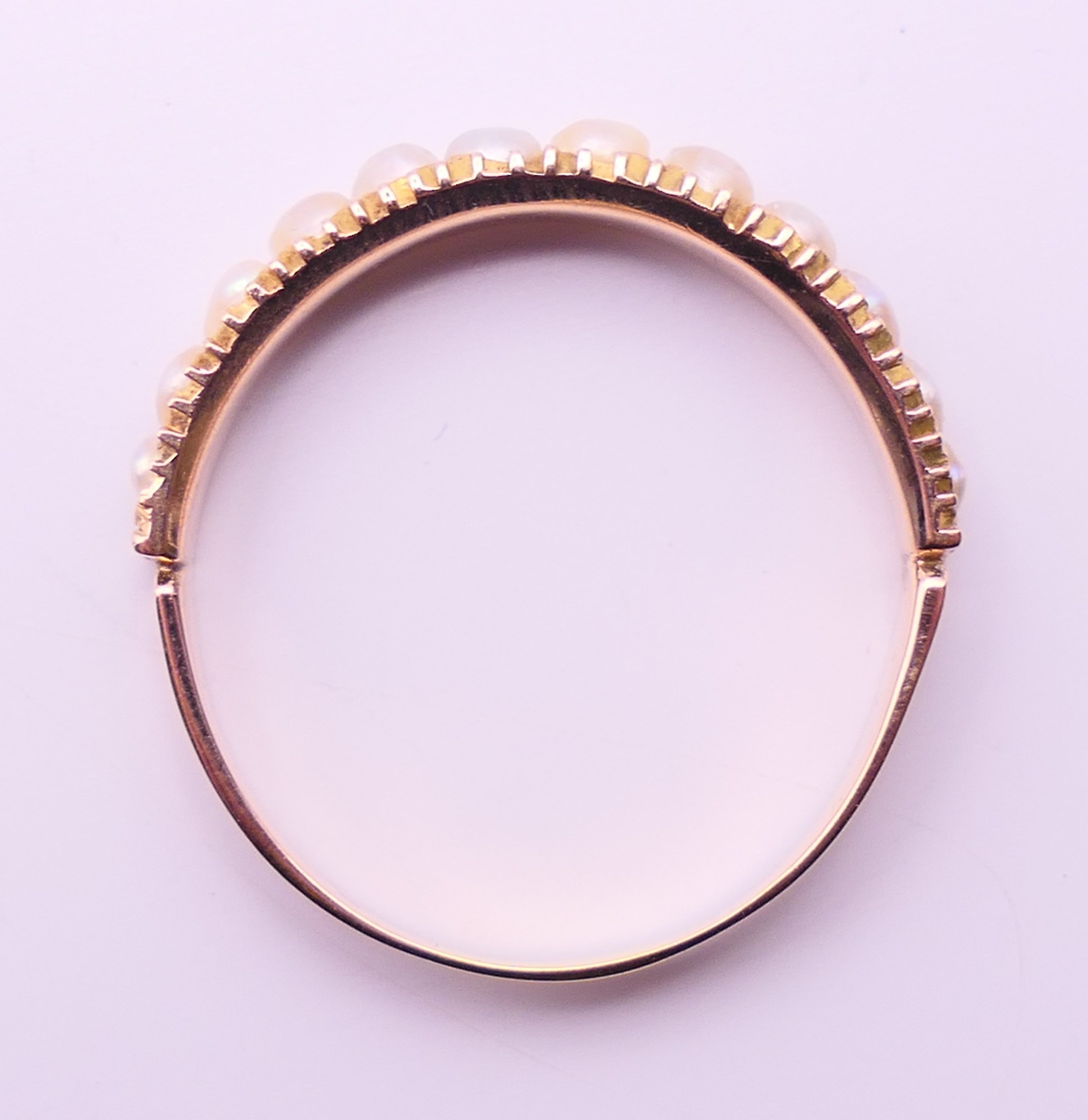 An unmarked gold, diamond and seed pearl ring, and another unmarked gold and seed pearl ring. - Image 6 of 11