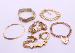 A quantity of 9 ct gold bracelets, to include a heart padlock bracelet. Each approximately 18.