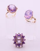 Two 9 ct gold and amethyst rings 13.4 grammes total weight and a 14 ct gold and amethyst ring 8.