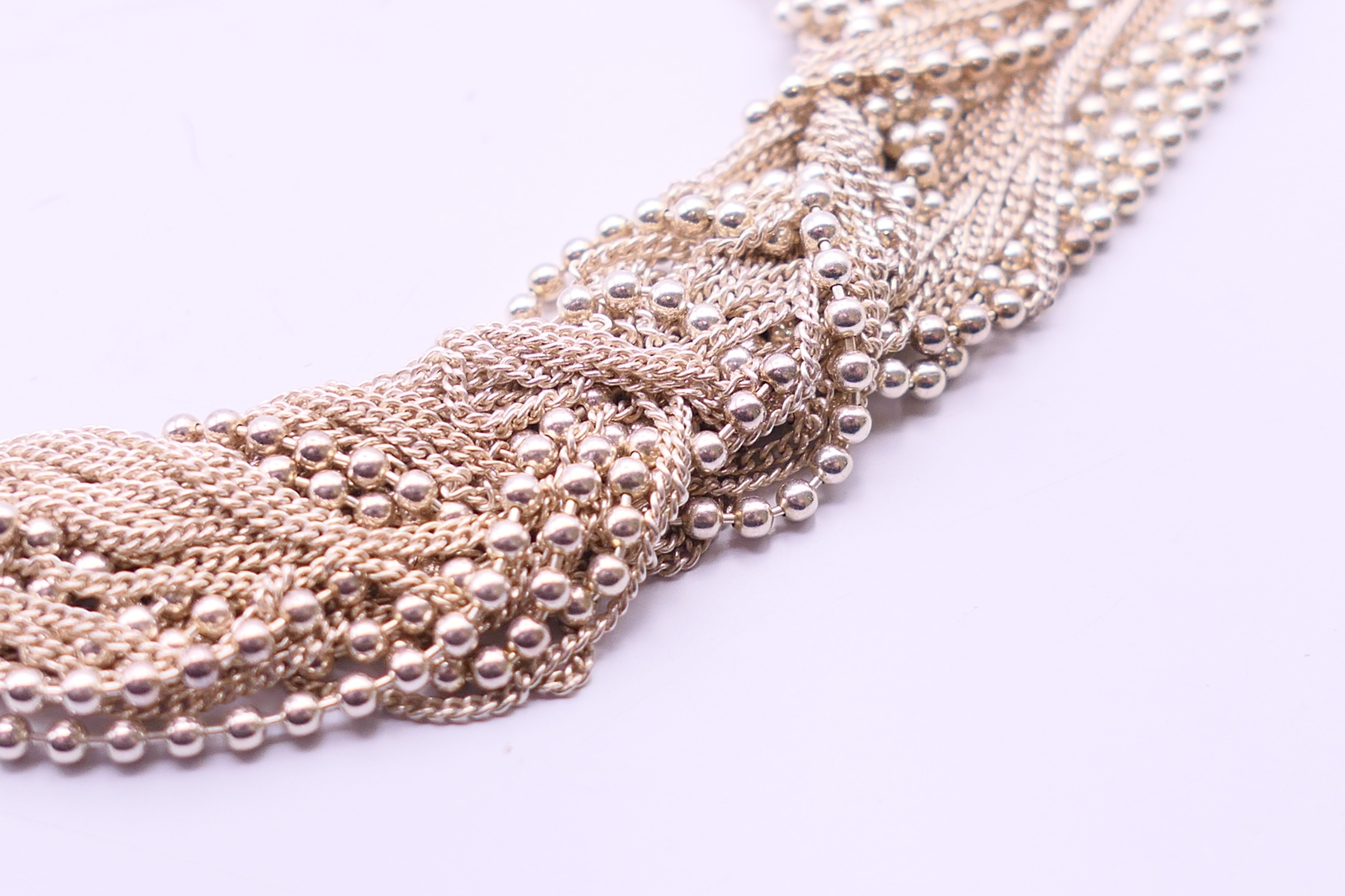 A silver charm bracelet and a silver necklace. The later 34 cm long. - Image 3 of 9