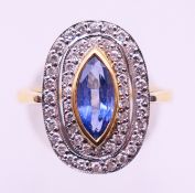 An 18 ct gold, diamond and sapphire ring. Ring size P/Q.