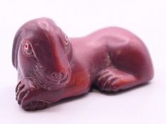 A netsuke formed as a rabbit/hare. 5.5 cm long.