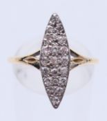 An 18 ct gold diamond navette ring. Ring size Q.