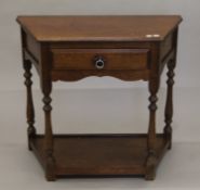 An oak single drawer side table. 83 cm wide.