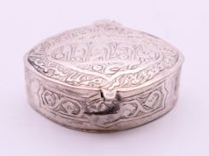 An Arabic silver snuff box. 4.5 cm wide x 1.5 cm high.