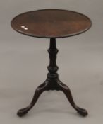 A 19th century mahogany tilt-top tripod table. 56 cm diameter.