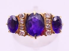 An 18 ct gold, diamond and amethyst ring. Ring size O/P.