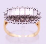An 18 ct gold diamond cluster ring. Ring size O.
