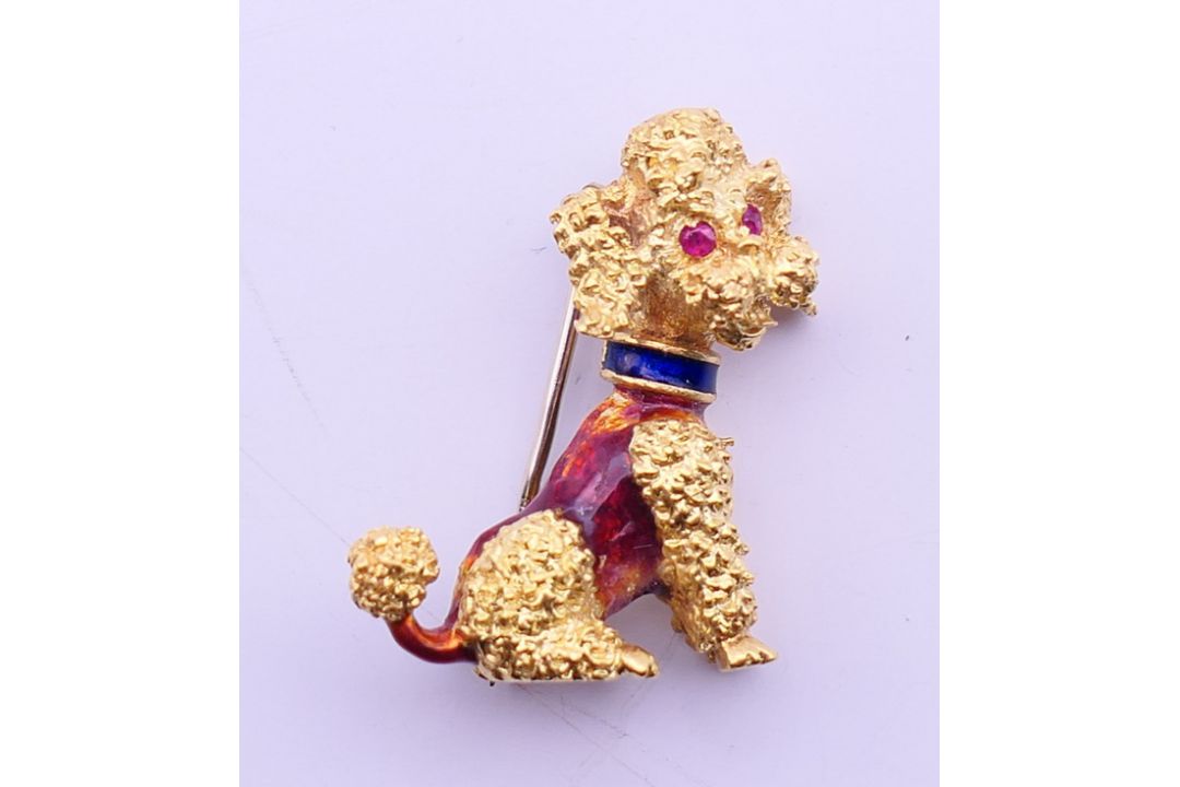 An 18 ct gold poodle dog brooch with ruby set eyes and enamel decoration.. 2.75 cm high. 8. - Image 1 of 3