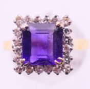 An 18 ct gold, diamond and amethyst ring. Ring size Q.