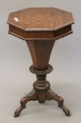 A Victorian inlaid walnut trumpet work table. 72 cm high.