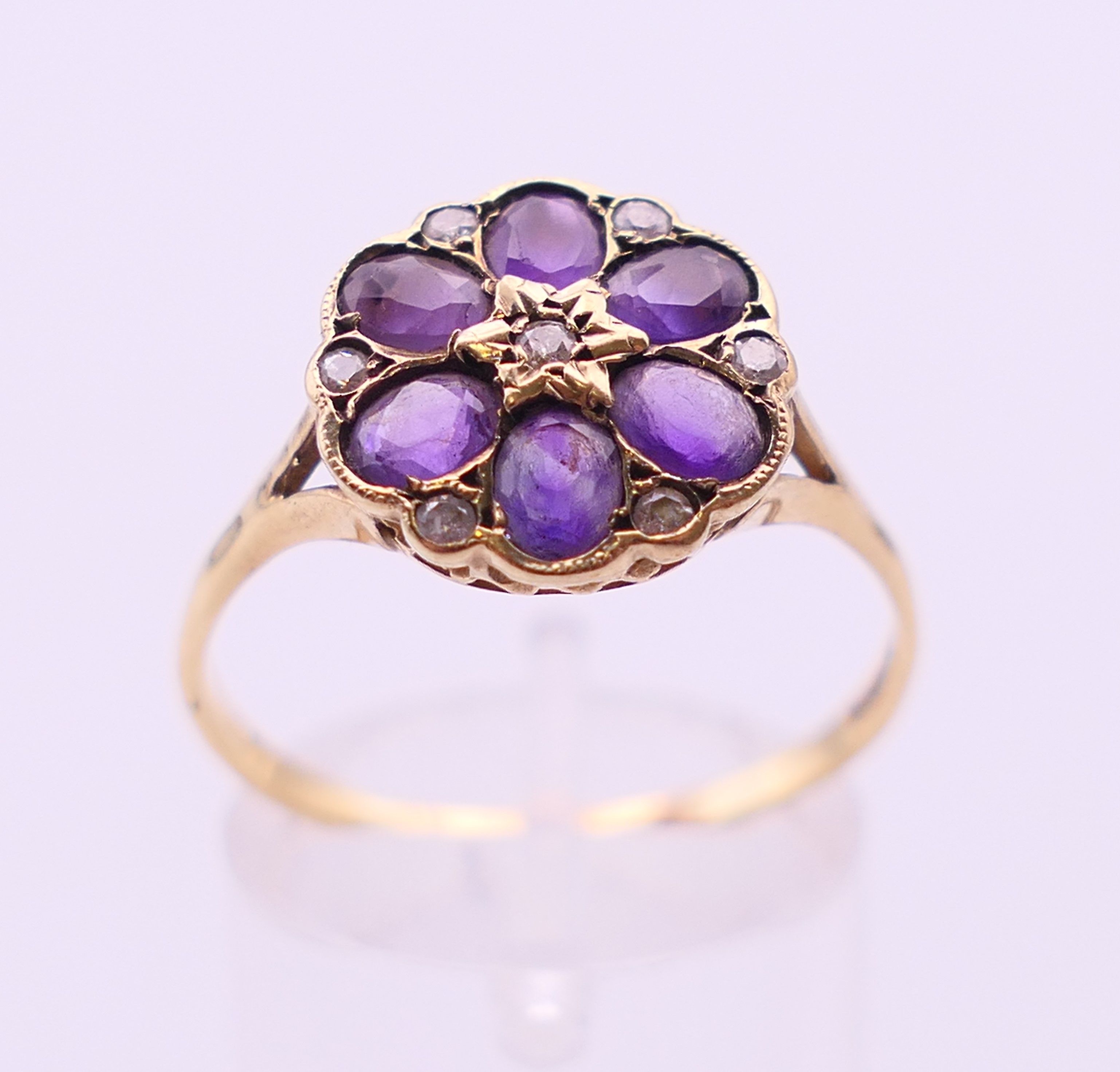 A 9 ct gold, amethyst and diamond cluster ring. Ring size U. - Image 2 of 5