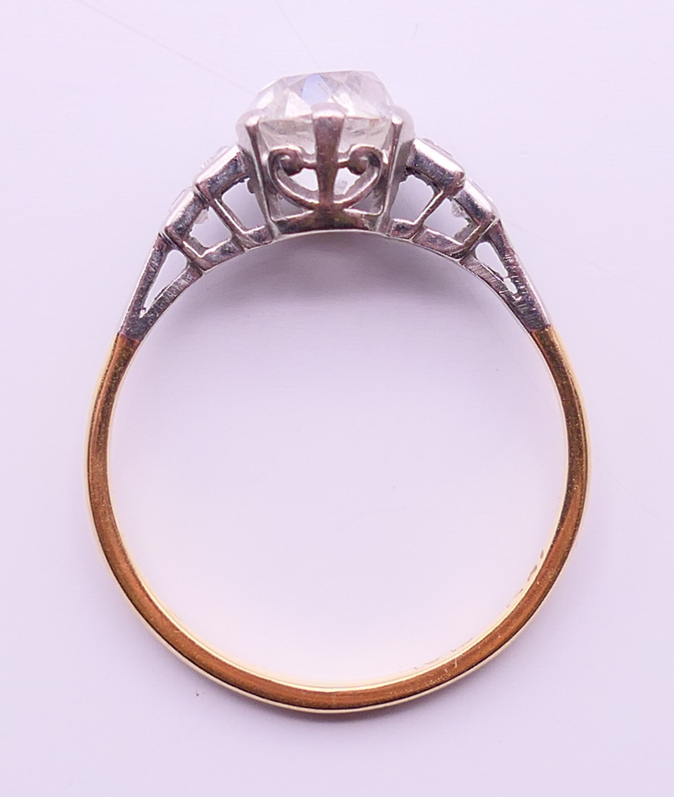 An 18 ct gold and platinum five stone diamond ring. The central stone spreading to approximately 1. - Image 5 of 5