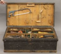 A Victorian tool box containing a large quantity of tools. 95 cm wide.