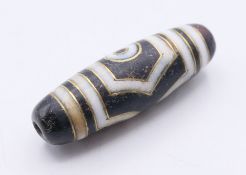 A gold inlaid agate bead. 3.75 cm high.