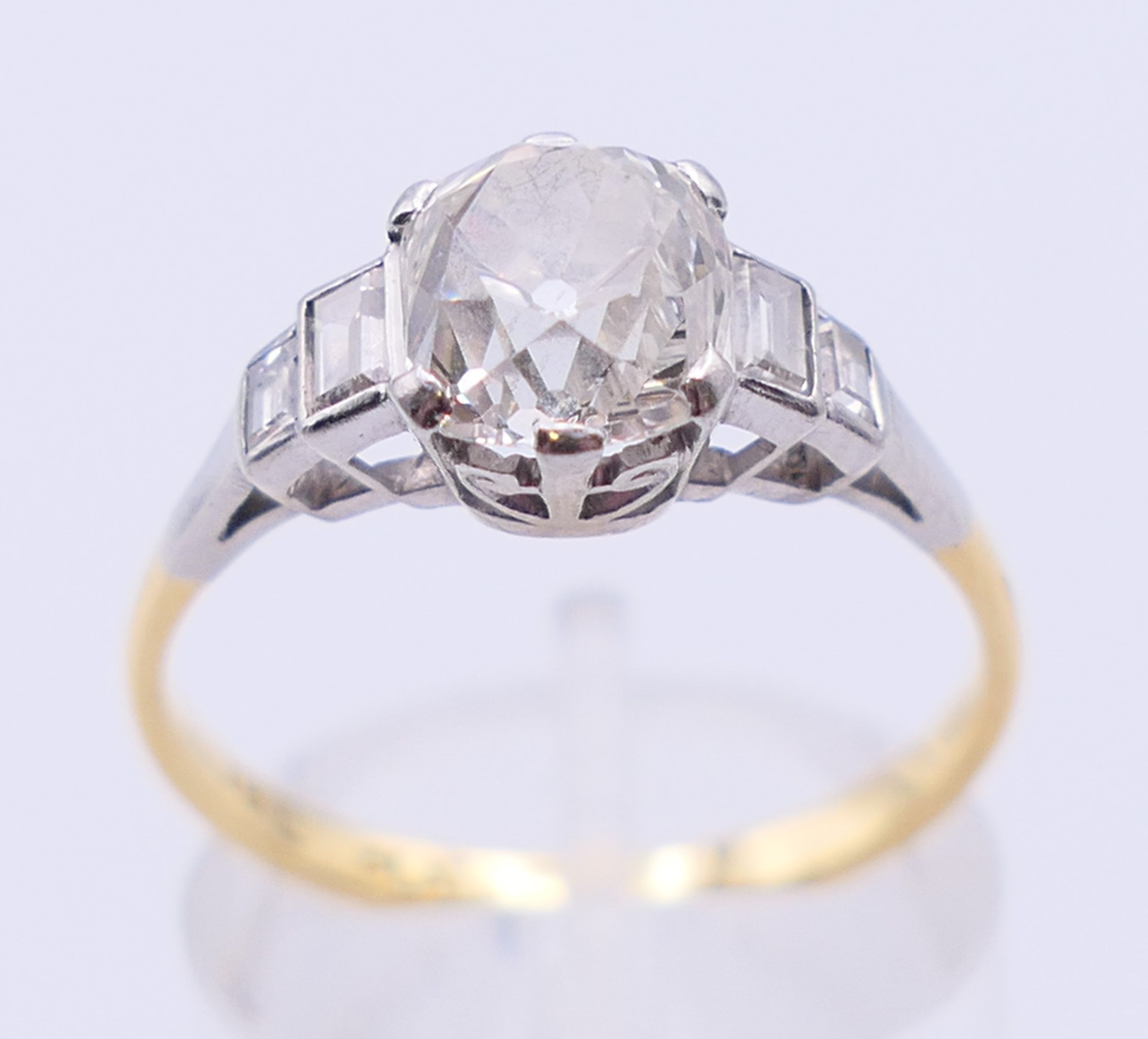 An 18 ct gold and platinum five stone diamond ring. The central stone spreading to approximately 1. - Image 2 of 5