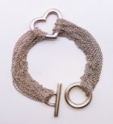 A Tiffany & Co silver bracelet, Elsa Peretti open heart multi-chain design. 18 cm long.