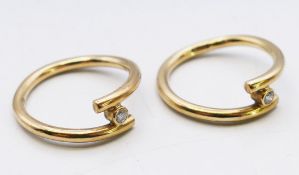 Two 9 ct gold and diamond inter wearable band rings. Ring size K. 4.7 grammes total weight.