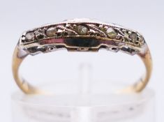 A 9 ct gold and diamond ring. 1.2 grammes. Ring size L.