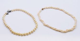 A three-strand seed pearl necklace and a single strand pearl necklace.