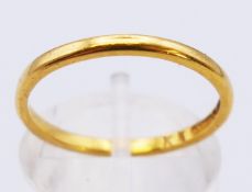 A 22 ct gold wedding band. 2.3 grammes. Ring size O.