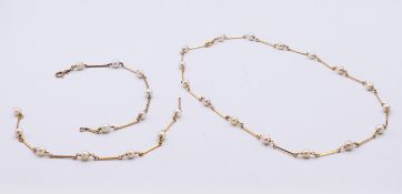 An 18 ct gold and pearl necklace,