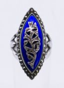 A silver, blue enamel and marcasite ring. Ring size O.