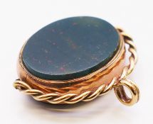 A 9 ct gold bloodstone and cornelian swivel fob. 7 grammes. 2.75 cm high.