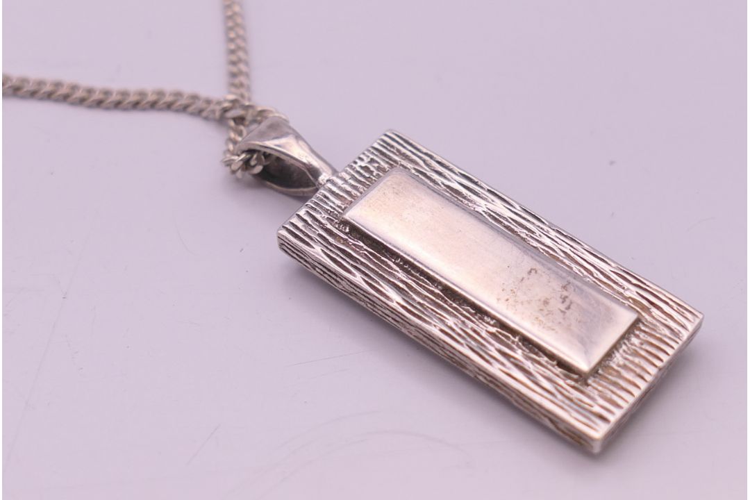 A silver ingot pendant on a silver chain. - Image 4 of 6