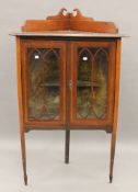 An Edwardian mahogany corner cabinet. 77 cm wide x 125 cm high.