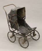 A Victorian child's pram. 67 cm high.